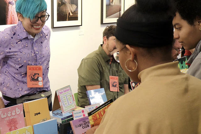 A drawing by a pre-k student of two hearts and a hand