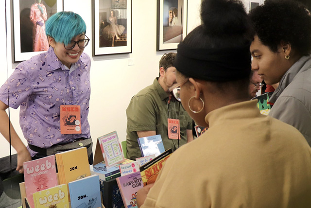 A drawing by a pre-k student of two hearts and a hand