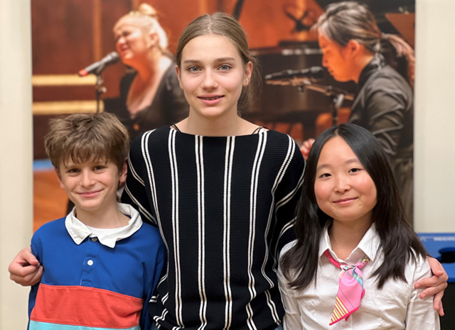 A drawing by a pre-k student of two hearts and a hand